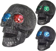 Caveira com luz nos olhos em cores sortidas 14 cm